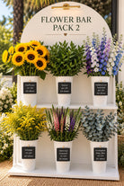 Flower Bar Pack 2 DIY flower bar display with sunflowers, ruscus, delphinium, solidago, veronica and eucalyptus in white buckets
